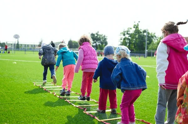 Children outdoors playing keeping active