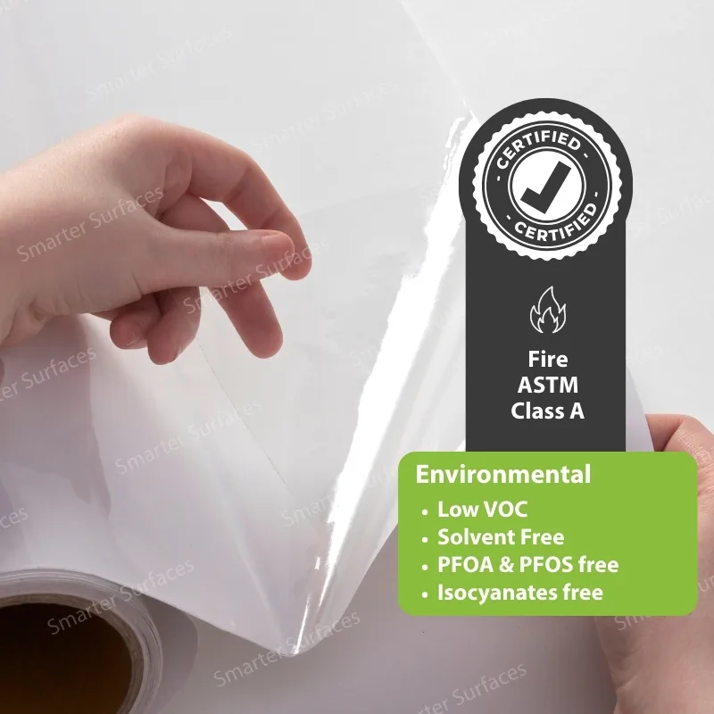 Hand peeling clear dry-erase film showing environmental certification icon
