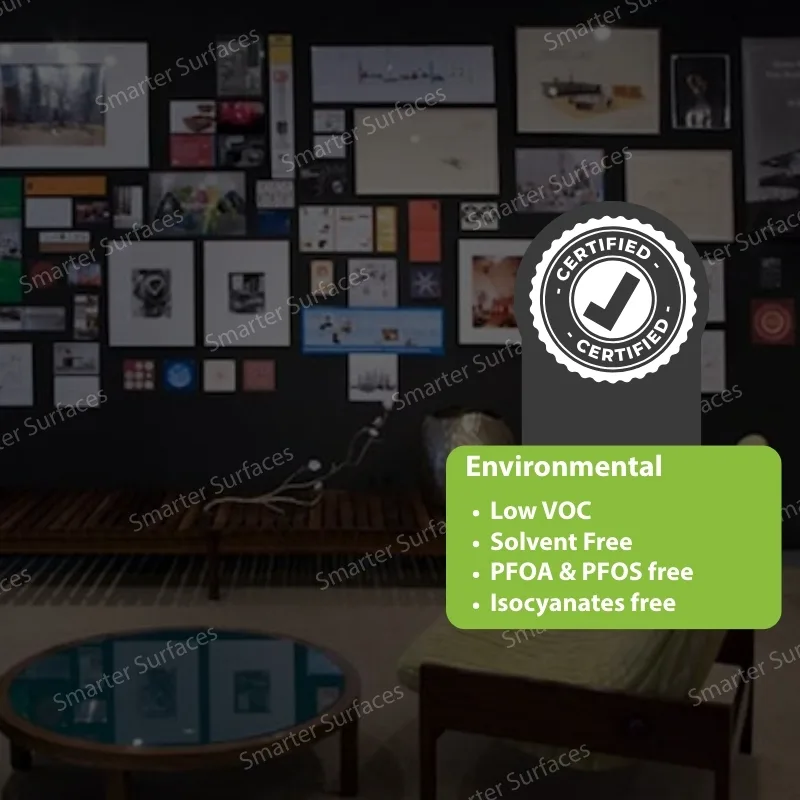 Black DIY magnetic plaster wall displaying photos, documents and artwork with certified eco-friendly badge, low VOC, solvent free, PFOA and PFOS free, and isocyanates free formula.