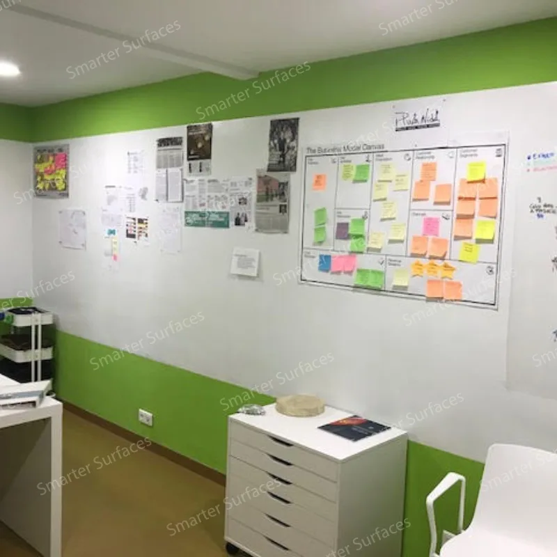 Modern office workspace displaying colorful sticky notes and kanban board for agile project management.