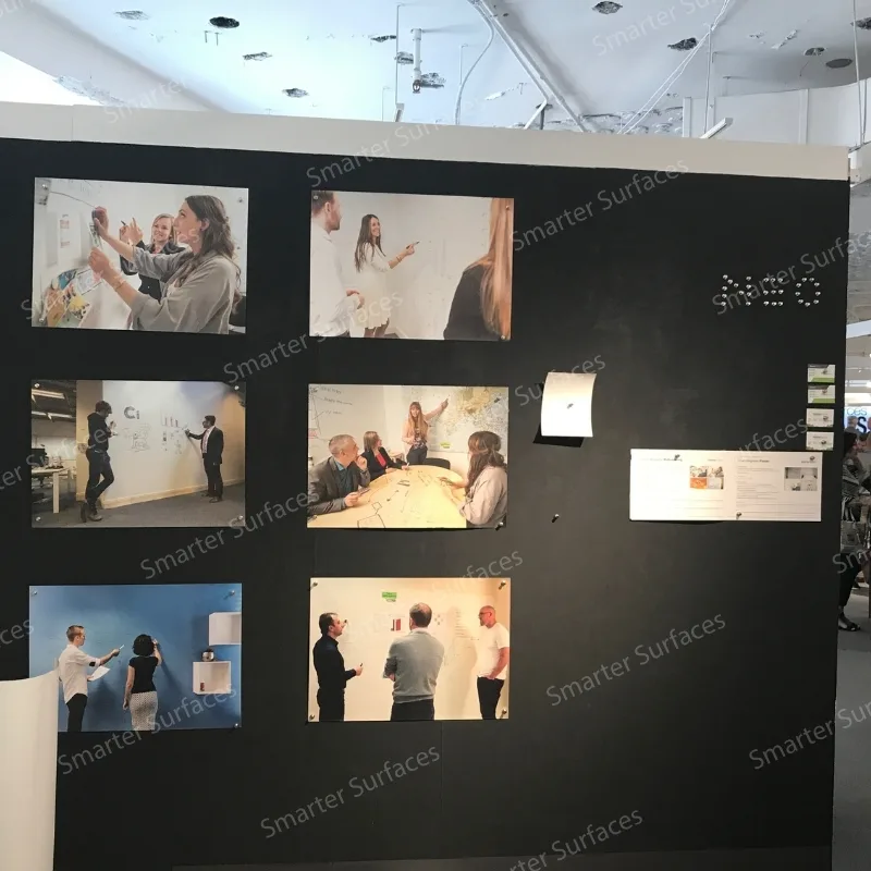 Large black DIY magnetic plaster wall displaying multiple presentation screens in grid layout.