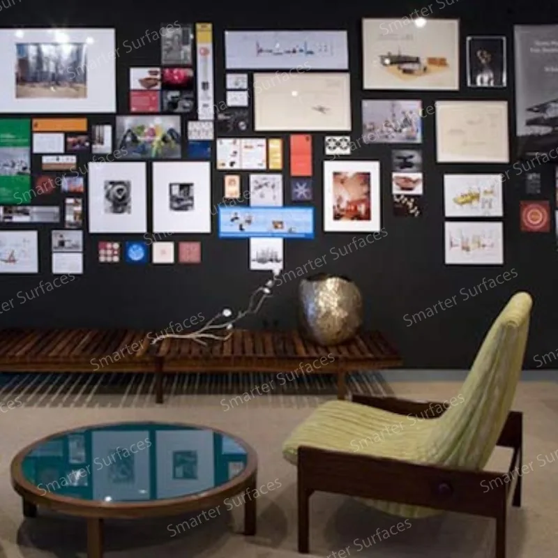 Modern room featuring best magnetic plaster wall displaying creative gallery of photos, artwork, documents and prints arranged in collage style.