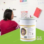 Woman working with magnetic plaster wall displaying colorful notes and calendar on magnetic receptive surface