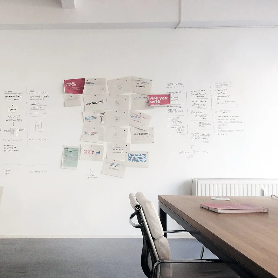 Magnetic plaster white wallcovering in conference room