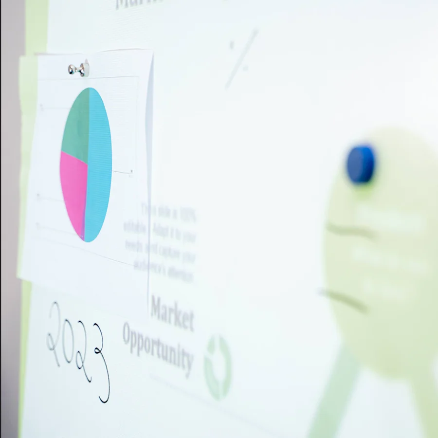 Magnets holding papers on magnetic projector screen wallcovering