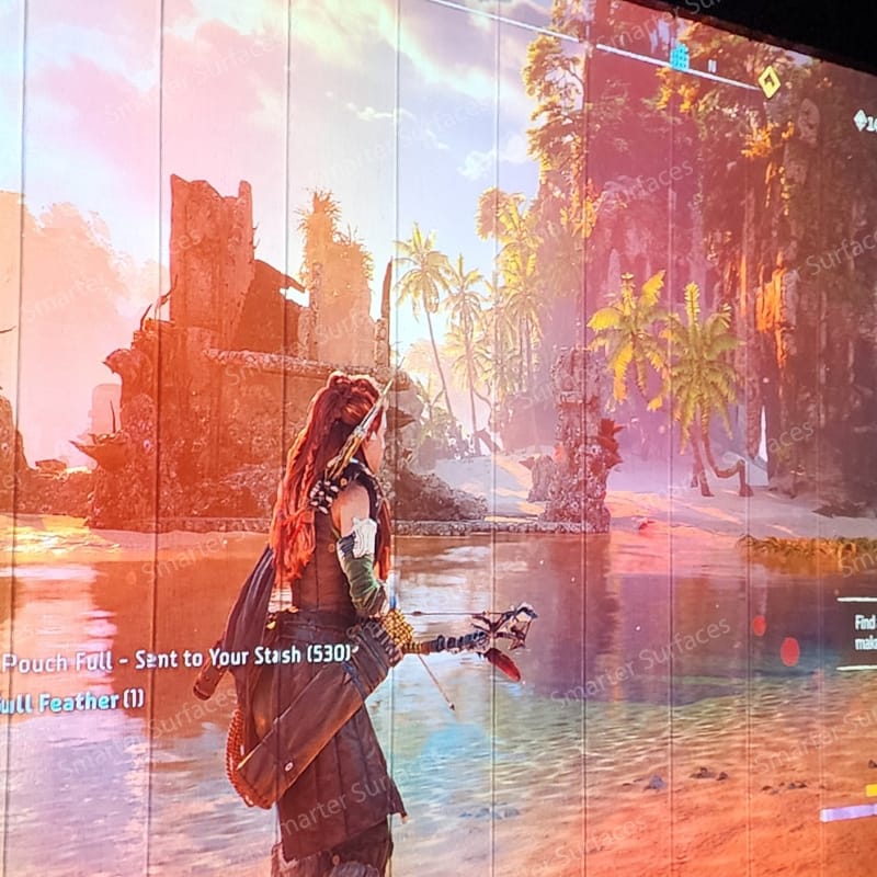 Outdoor gaming scene projected on a painted wall