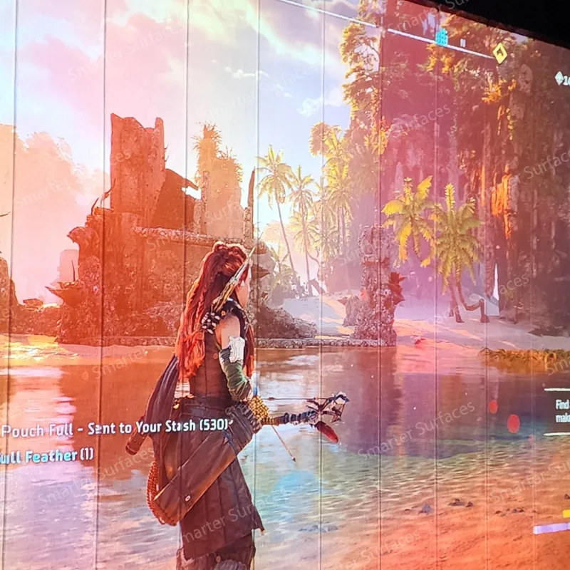 Outdoor gaming scene projected on a painted wall