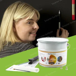 Woman applying Super Magnetic Paint on a wall using Smarter Surfaces strong magnetic wall kit