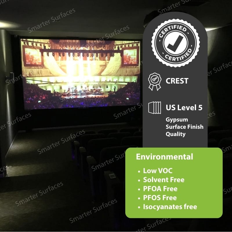 Projector screen in a dark room with certification icons displayed