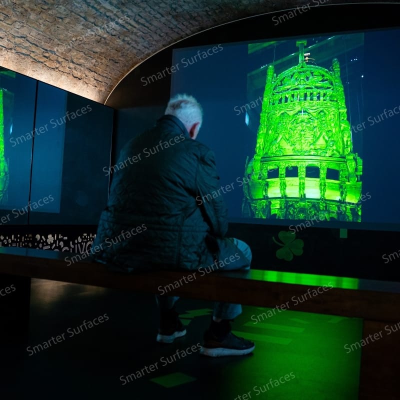 Person observing a vivid high-contrast green projection