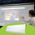 A woman interacting with a projected image on a whiteboard self-adhesive film